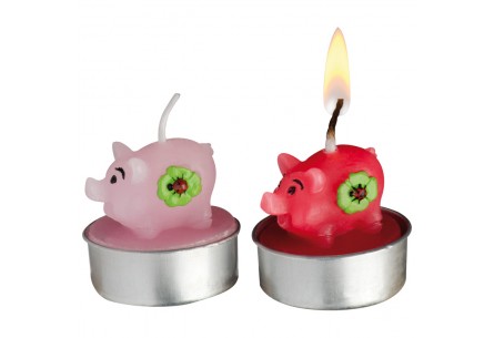 Świeczki w kształcie radosnych świnek